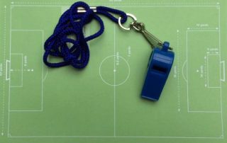 Coach's notes and whistle.